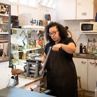 Ella McIntosh (pewtersmith) in studio. Image credit - Eden Photography