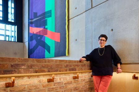 Eva Rothschild in front of tapestry commission at Sadler's Wells East image credit Rich Lakos