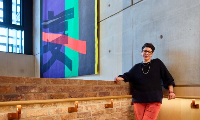 Eva Rothschild in front of tapestry commission at Sadler's Wells East image credit Rich Lakos