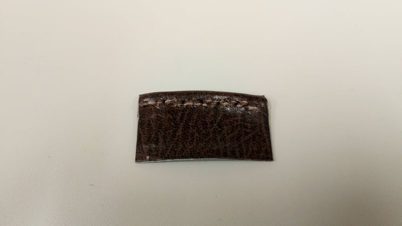 Figure 8: Saddle stitch endband model sewn with leather strip (spine view)