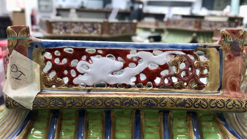 First layer of colour matching the deep red below the gilding. This also helps to define the outline of the dragon. 