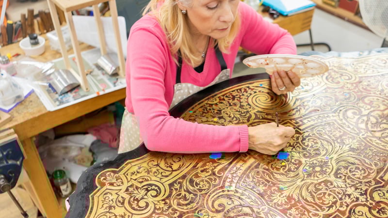 Student conserving furniture at West Dean College of Arts and Conservation