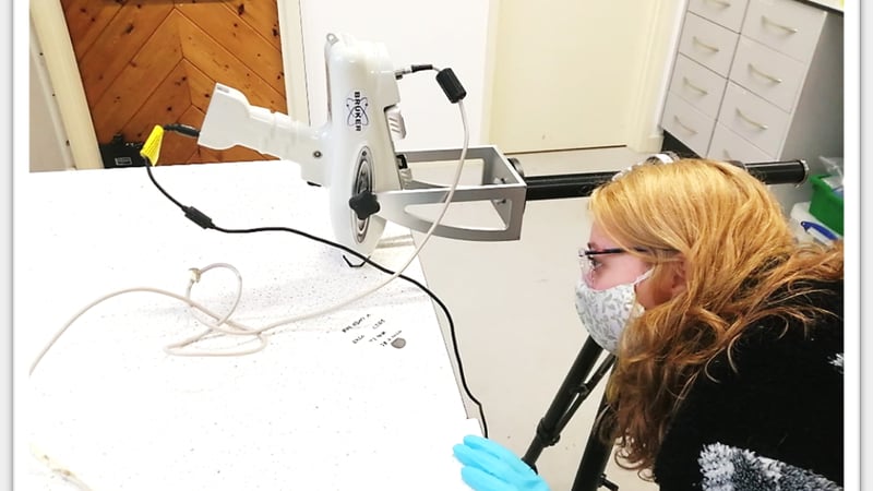 Figure 2 Here I am positioning the XRF equipment to get an accurate reading of the coin