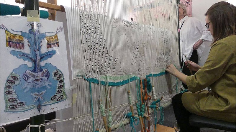 Trainee Weaver Emma Straw worked with Master Weaver Philip Sanderson on the tapestry interpretation of Edward James' watercolour 