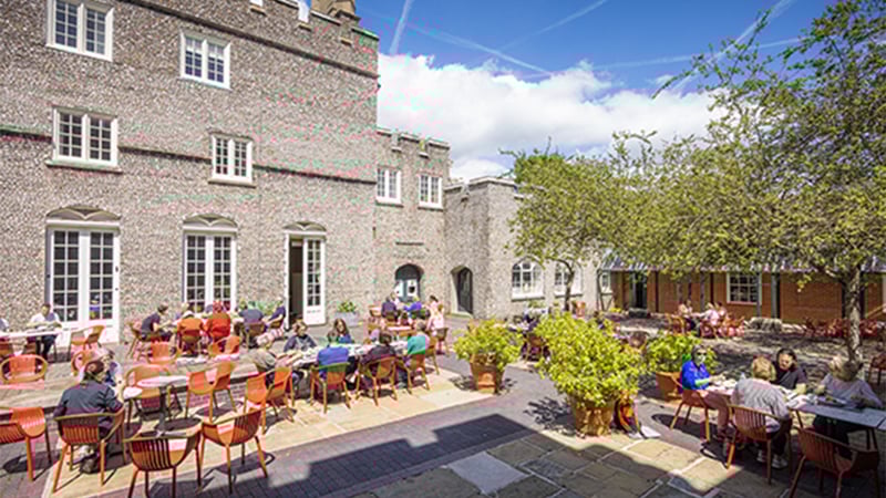 students socialising in courtyard credit_Chris_Ison