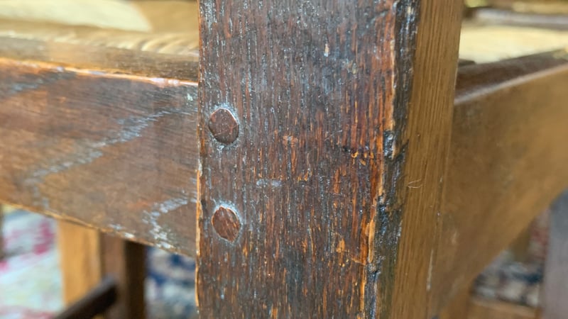 Fig 2. Oak pegs visible in the back leg to seat frame joint