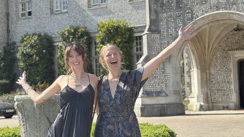 Student celebrating graduating with friends
