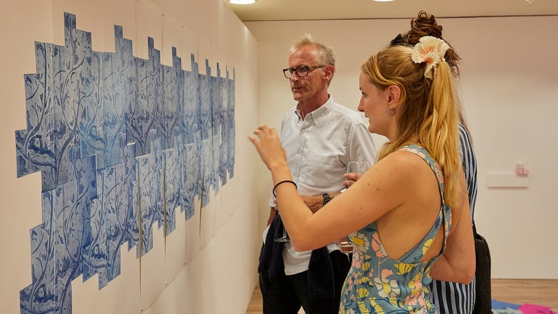 Maud Boothby with visitors at the Angel Cake preview. Photo by Barney Hindle. 