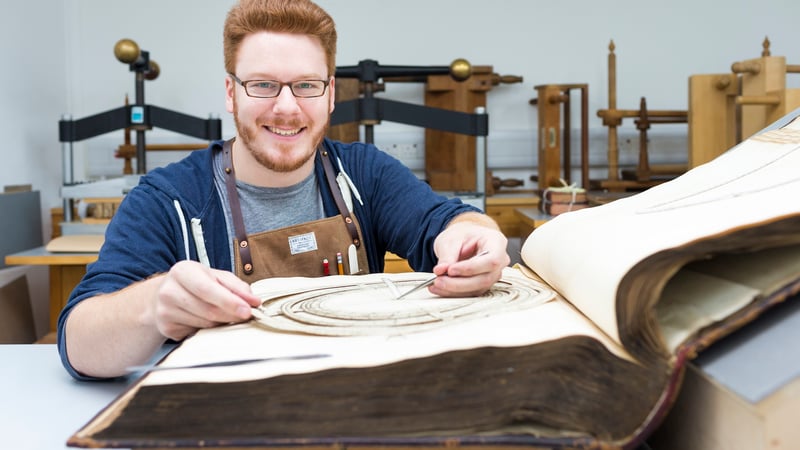 Student learning to conserve book at West Dean College of Arts and Conservation