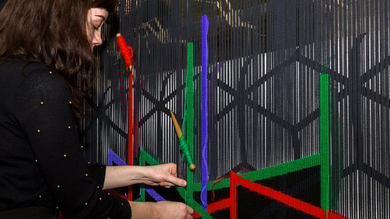 Preparing to cut off the Eva Rothschild Tapestry