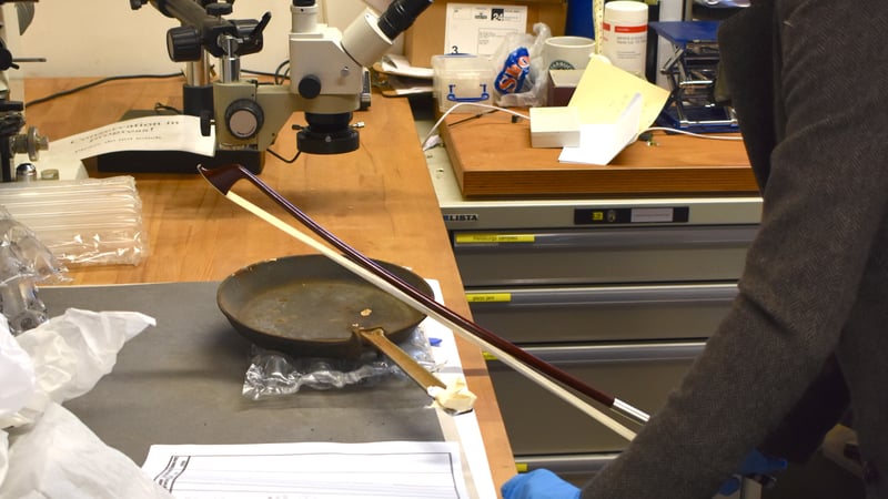 Mary Hampton bowing the Batterie de Cuisine 