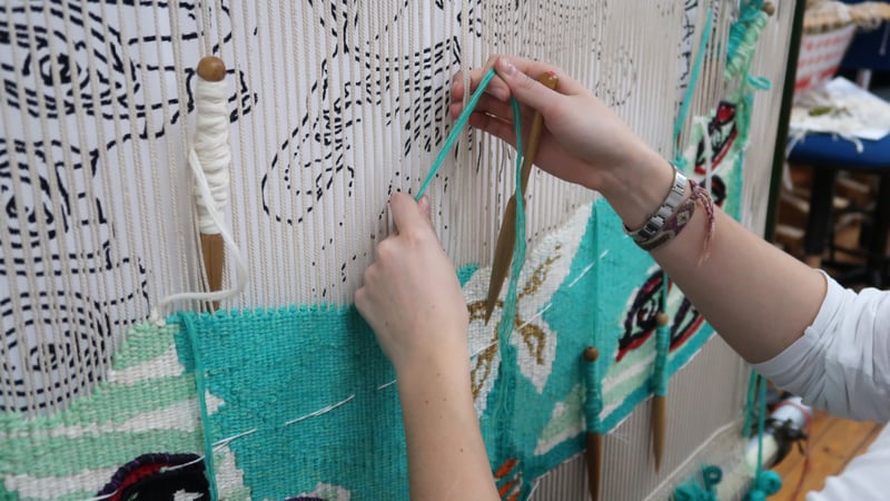Emma Straw weaving 'The Empress of the Insects' at West Dean Tapestry Studio 