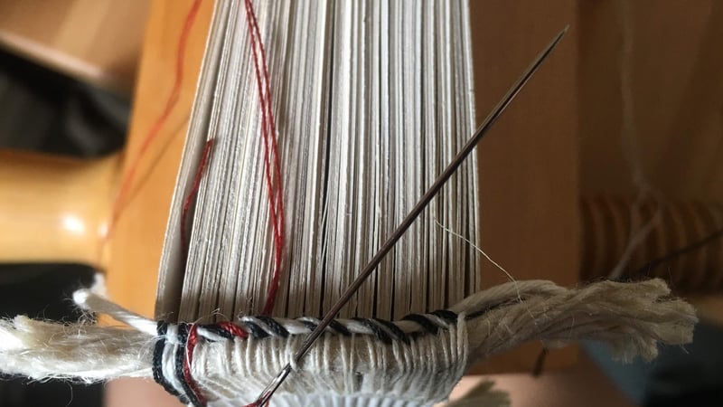 Figure 2: Addition of first secondary endband, with the traditional colours of red, white and black.