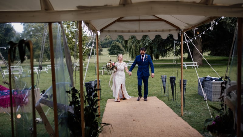 Bride and groom in the wedding marquee. Credit Esme Ducker Photography