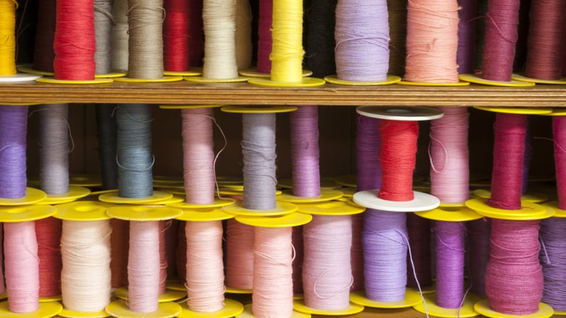 Sppols of yarns hand dyed at West Dean Tapestry Studio