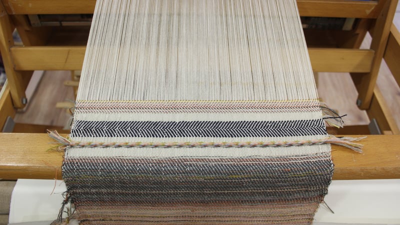 A cloth loom being tested in the studios
