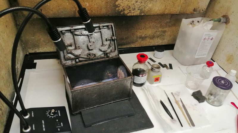 Fig 10. Application of the tannic acid solution to the interior of the casket.