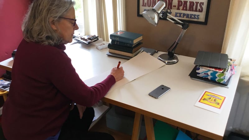 Jane is pictured at her writing desk.