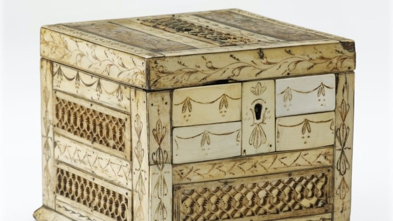  Figure 1: Wooden substrate, veneered with incised bone plates, fretted bone panels backed with gold leaf, and ivory piano key escutcheon and surround.