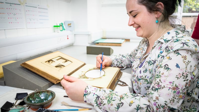 Student conserving a book at West Dean College of Arts and Conservation