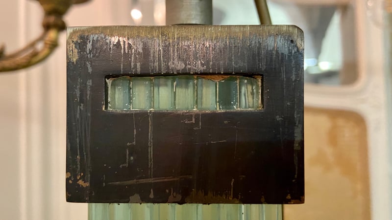 Detail of the layered glass design and the patinated bronze cube at the top, photo courtesy of Rose Zhou.