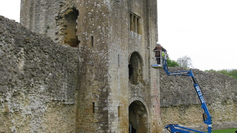 Cherry picker lift next to castle ruin Credit Graham Abrey
