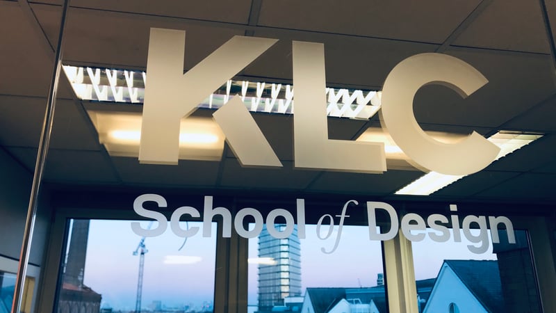 The KLC School of Design logo and London skyline reflected in a window.