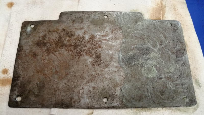 Fig 7 and 8. Interior panel during and after the application of PeekTM polishing compound, showing the areas of black corrosion which were present before exposure to water.