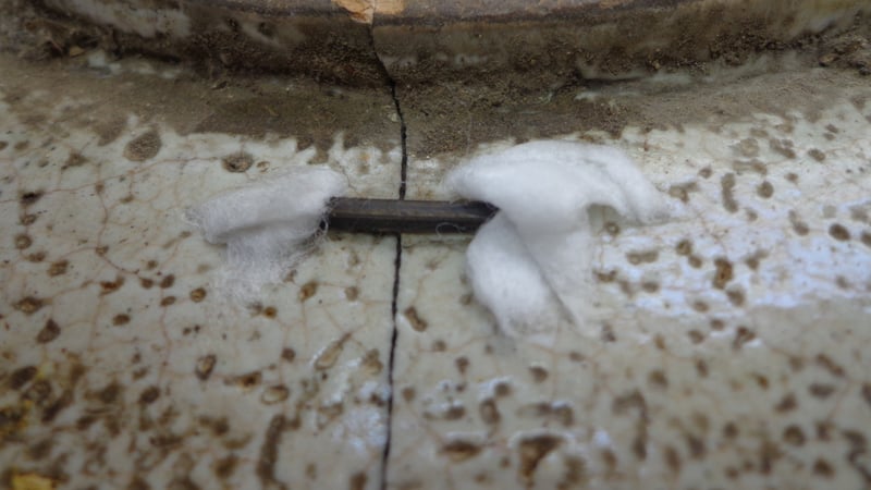 Figure 8 Removing old rivets with damp cotton wool