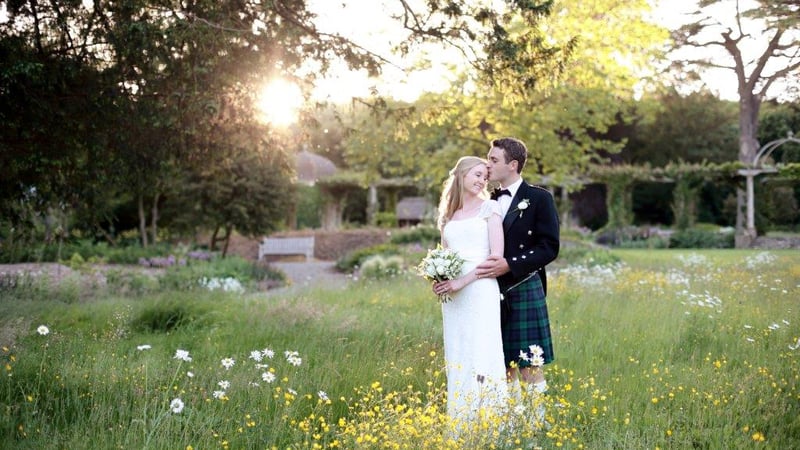 Couple on north lawn at West Dean Gardens. Image credit Dasha Caffrey
