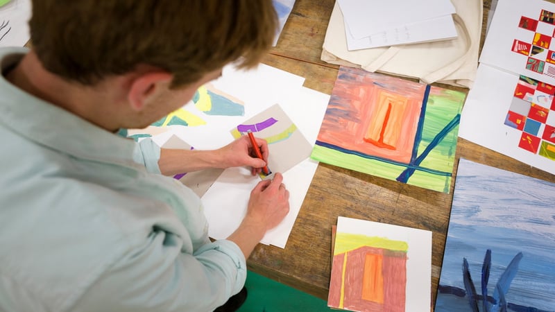 View looking over a student working on a mixed media artwork as part of the Foundation Diploma in Art and Design. Photo Credit Chris Ison