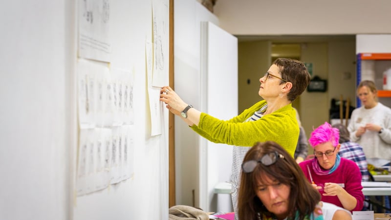 Student displaying work on a drawing day as part of the Foundation Diploma in Art and Design. Photo credit Chris Ison