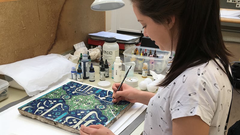 Ceramics conservation student on a work placement at the V&A museum
