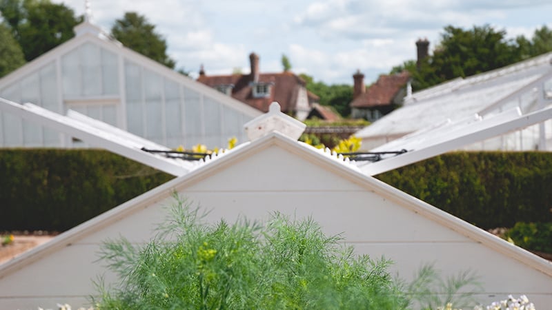 Glasshouses and cold frames at West Dean Gardens near Chichester