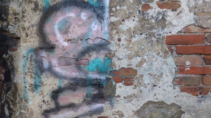 BEFORE: graffiti removal from historic plaster using proprietary gel