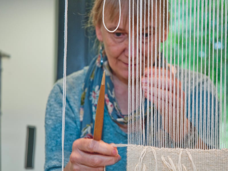 Student making a tapestry 
