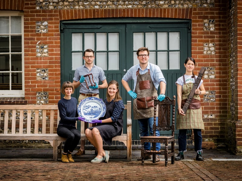 A group of West Dean students holding items they created