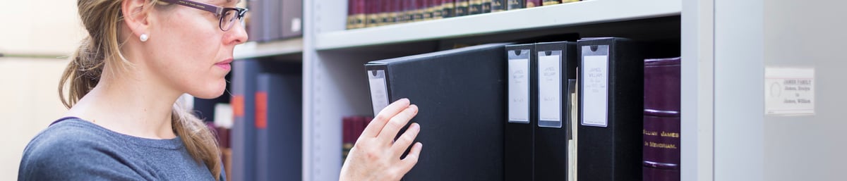 Collections Manager, Emma O'Driscoll in the Edward James Archive. 