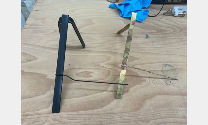 Completed mount on the left, with brass prototype on the right.