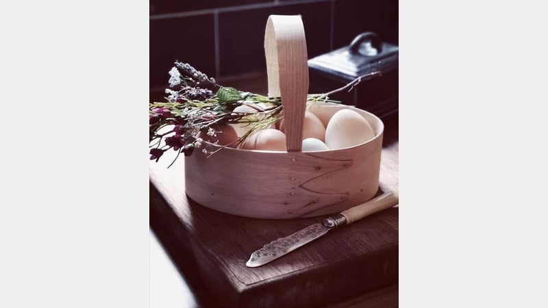 Shaker box with handle containing eggs and flowers
