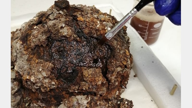 Fig 6 : Brushing  the tannic acid solution on to the remaining metal