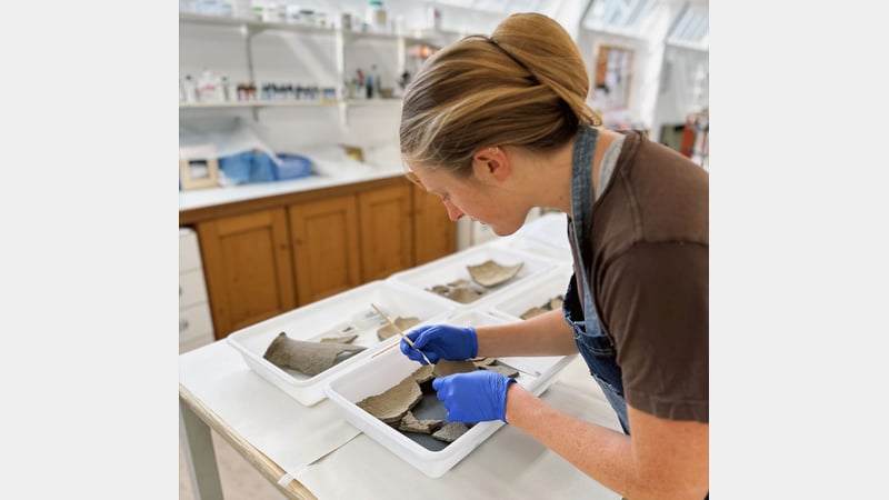 Ceramics Student Lotte, working on an archaeology item from the Novium Museaum