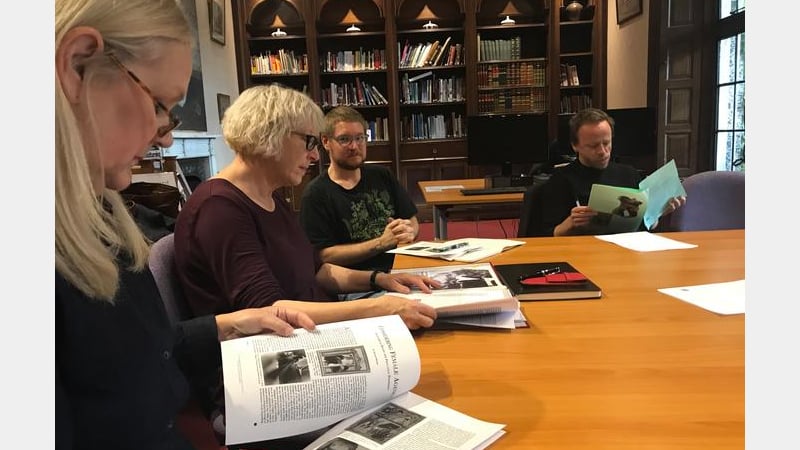 The Feminist and Queer Histories Reading Group meet in the library.
