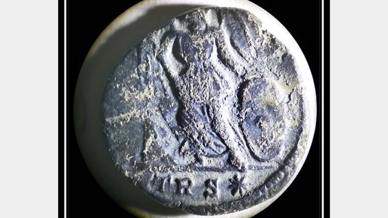 Figure 1 Roman coin under 10x microscope with raking light, measuring about 17mm diameter 