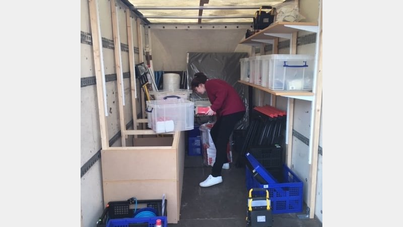 Sally Kilby working out the salvage trailer's storage logistics