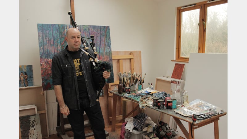 Haydn Cottam studio portrait with bagpipes