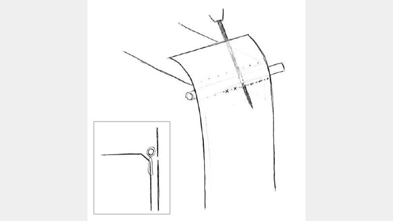 Figure 18: Piercing holes between the tie-downs underneath the primary endband