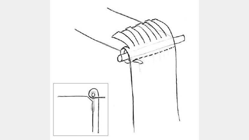Figure 20: Threading the strips through the corresponding holes on the spine