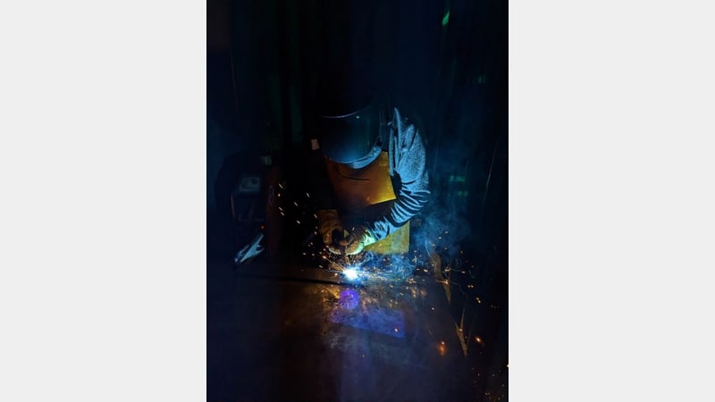 Figure 7. Welding the steel components of the mount.