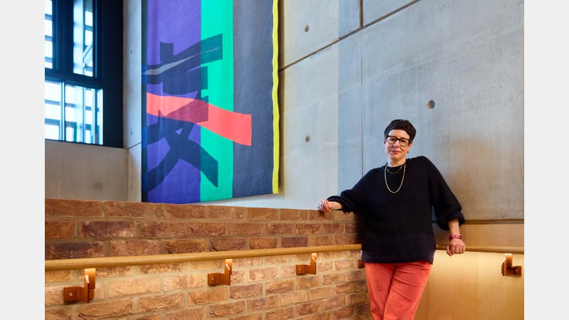 Eva Rothschild in front of tapestry commission at Sadler's Wells East image credit Rich Lakos